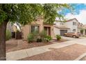 Charming two-story home with a well-manicured front yard and a two car garage at 19043 E Seagull Dr, Queen Creek, AZ 85142