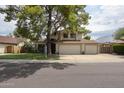 Charming two-story home with a spacious three car garage and mature landscaping at 4423 W Escuda Dr, Glendale, AZ 85308