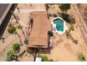 Aerial view of home with large pool and desert landscaping at 6428 E Shea Blvd, Scottsdale, AZ 85254