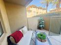 Inviting patio with cozy seating, stylish decor, and a view of lush landscaping at 815 E Rose Ln # 105, Phoenix, AZ 85014