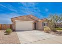 Welcoming single-Gathering home with a two-car garage and low-maintenance front yard at 947 E Wiley Way, Casa Grande, AZ 85122