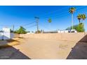 Spacious, low maintenance backyard with block fencing and a small brick structure at 1038 E Northern Ave, Phoenix, AZ 85020