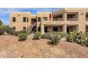 Desert condo featuring balcony, stairs, and mature cacti at 14645 N Fountain Hills Blvd # 208, Fountain Hills, AZ 85268