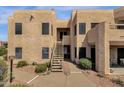 Condo exterior showcasing staircase, walkway and desert landscaping at 14645 N Fountain Hills Blvd # 208, Fountain Hills, AZ 85268