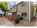 Charming two-story home featuring a gated entrance, well-maintained landscaping, and a welcoming facade at 2301 E University Dr # 393, Mesa, AZ 85213