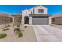 Charming single-Gathering home with a well-maintained desert landscape and a spacious two-car garage at 2377 S 245Th Dr, Buckeye, AZ 85326