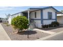 Inviting home with covered entryway, manicured yard, and well-maintained landscaping at 2650 W Union Hills Dr # 230, Phoenix, AZ 85027