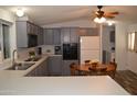 Updated kitchen with modern appliances, ample counter space, and an adjacent eating area at 2650 W Union Hills Dr # 230, Phoenix, AZ 85027