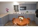 Well-equipped kitchen with modern appliances and a charming breakfast nook at 2650 W Union Hills Dr # 230, Phoenix, AZ 85027