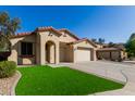 Beautiful single-story home featuring a well-manicured lawn, neutral stucco, and a spacious driveway with a three car garage at 27089 N 172Nd Ln, Surprise, AZ 85387
