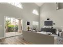 Open-concept living room with large sliding glass doors leading to an outdoor area at 3832 N Gallatin --, Mesa, AZ 85215