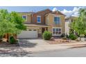 Charming two-story house with a small balcony, well-kept landscaping, and an attached three-car garage at 4125 W Lydia Ln, Phoenix, AZ 85041