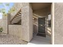 Close up of unit entryway with a secure screen door and direct stairwell access at 5450 E Mclellan Rd # 145, Mesa, AZ 85205