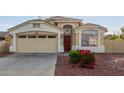 Charming home showcasing a two-car garage, well maintained landscape, and inviting front entrance at 7215 N 76Th Ave, Glendale, AZ 85303