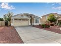 Inviting single-Gathering home with a two-car garage and low-maintenance desert landscaping in a friendly neighborhood at 7215 N 76Th Ave, Glendale, AZ 85303