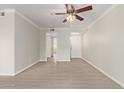 Bright living room featuring wood-look floors, a ceiling fan, and fresh paint at 8256 E Arabian Trl # 239, Scottsdale, AZ 85258
