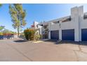 Stylish two-story condo building with private garage entrances, balconies, and landscaping at 902 W Glendale Ave # 215, Phoenix, AZ 85021