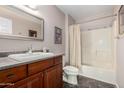 Bathroom with a shower-tub combo and cherry wood vanity at 1440 N Idaho Rd # 2053, Apache Junction, AZ 85119
