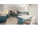 Stylish kitchen features stainless steel appliances, white countertops and two-tone cabinetry at 1825 S Spruce --, Mesa, AZ 85210
