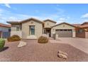 Charming single-story home with desert landscaping, gated entry, and a two-car garage at 20340 E Camacho Rd, Queen Creek, AZ 85142