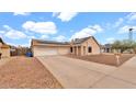 Charming single-story home with desert landscaping and a two-car garage at 2234 W Mohawk Ln, Phoenix, AZ 85027