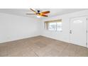 Bright living room with tile flooring and a ceiling fan at 2262 E Javelina Ave, Mesa, AZ 85204
