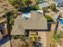 Aerial view of a single-Gathering home featuring a fenced pool and lush landscaping at 2433 E Acoma Dr, Phoenix, AZ 85032