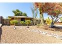 A charming one story house with desert landscaping at 2433 E Acoma Dr, Phoenix, AZ 85032