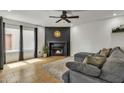 Cozy living room featuring a modern fireplace and comfortable sectional seating on a neutral rug at 2834 S Extension Rd # 1079, Mesa, AZ 85210
