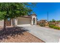 Attractive single-story home with a two-car garage, desert landscaping, and a covered entryway at 4094 E Los Altos Dr, Gilbert, AZ 85297