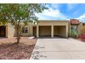 Charming home exterior with desert landscaping, covered parking, and a welcoming entrance at 747 W Rice Dr, Tempe, AZ 85283