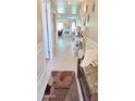 Bright hallway featuring neutral walls, decorative accents, and tiled floors leading to multiple living spaces at 8020 E Keats Ave # 279, Mesa, AZ 85209
