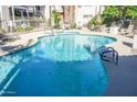 Sparkling community pool with multiple entry points and lounge seating provides a relaxing atmosphere at 930 N Mesa Dr # 2027, Mesa, AZ 85201