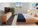 Cozy bedroom with a plush rug and modern furniture, offering a comfortable retreat at 13481 W Buckskin Trl, Peoria, AZ 85383