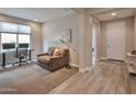 Inviting living room featuring neutral tones, plush seating, and stylish decor elements at 16911 W Palm Ln, Goodyear, AZ 85395