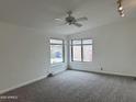 Neutral bedroom featuring new carpet and natural light from the large window at 1822 E Roma Ave, Phoenix, AZ 85016