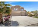 Charming two-story home featuring a spacious three-car garage, nice driveway and lawn and backyard patio at 19616 N Toya St, Maricopa, AZ 85138