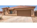Attached two-car garage with extended driveway offering convenience and ample parking space at 3107 S 74Th Ln, Phoenix, AZ 85043