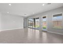 Spacious living room with tile flooring and ample natural light at 5619 N 193Rd Ave, Litchfield Park, AZ 85340