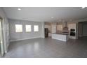 Spacious open concept living area with direct access to the modern kitchen at 5619 N 193Rd Ave, Litchfield Park, AZ 85340