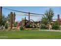 Modern playground with climbing structures and sun shades in a community park at 5619 N 193Rd Ave, Litchfield Park, AZ 85340