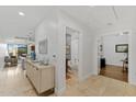 Inviting hallway leading to a bathroom and office, plus views of the dining and living areas at 6803 E Main St # 1106, Scottsdale, AZ 85251