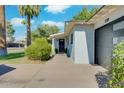 Inviting single-story home with a modern garage and manicured front yard at 8319 E Indianola Ave, Scottsdale, AZ 85251