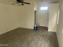 Bright living room featuring stylish tile flooring and neutral walls at 8349 W Holly St, Phoenix, AZ 85037