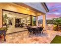 Expansive patio with dining area and seamless transition to the indoor living space at 851 E Deer Creek Rd, Phoenix, AZ 85048