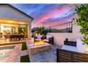 Inviting patio with a fire pit and outdoor seating, ideal for relaxation and entertaining at 851 E Deer Creek Rd, Phoenix, AZ 85048