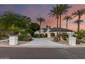 Beautiful home featuring manicured landscaping, mature trees, and a spacious driveway with elegant curb appeal at 11827 S Montezuma Ct, Phoenix, AZ 85044