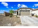 Charming single-story home featuring a low-maintenance yard and an attached two-car garage and covered front porch at 12472 W Kaler Dr, Glendale, AZ 85307