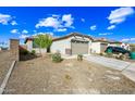 Charming single-story home featuring a low-maintenance yard and an attached two-car garage and covered front porch at 12472 W Kaler Dr, Glendale, AZ 85307