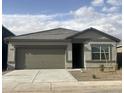 Well maintained single story home featuring a two-car garage and desert landscaping at 13198 E Verbina Ln, Florence, AZ 85132